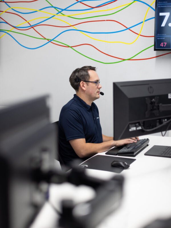 A CHS Networks team member supporting a client on cloud computing issue